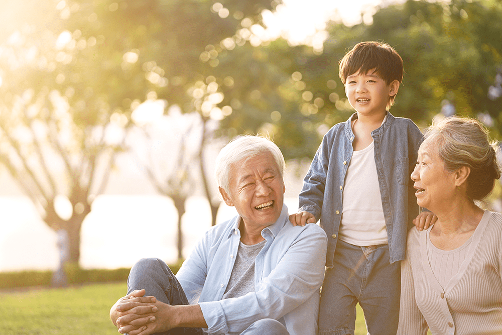 Grandparents laughing with grandchild