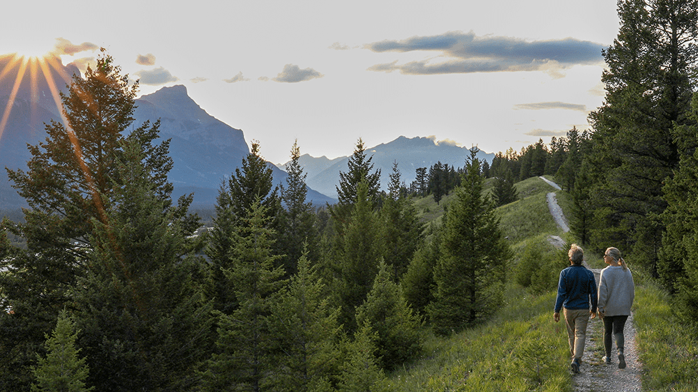 Happy couple hiking in retirement after purchasing an annuity