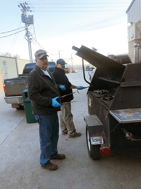 Members frying brats