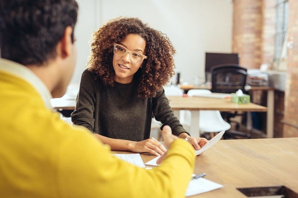 Woman talking to BetterLife agent about life insurance
