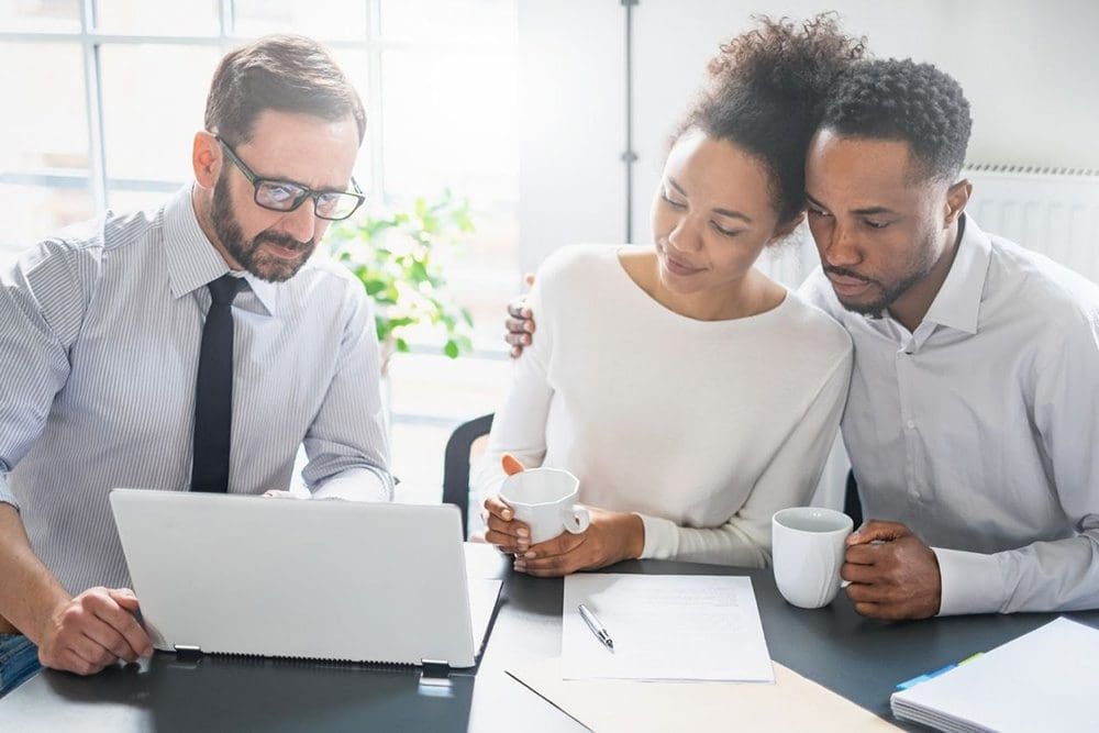 Couple looking over life insurance options with BetterLife agent