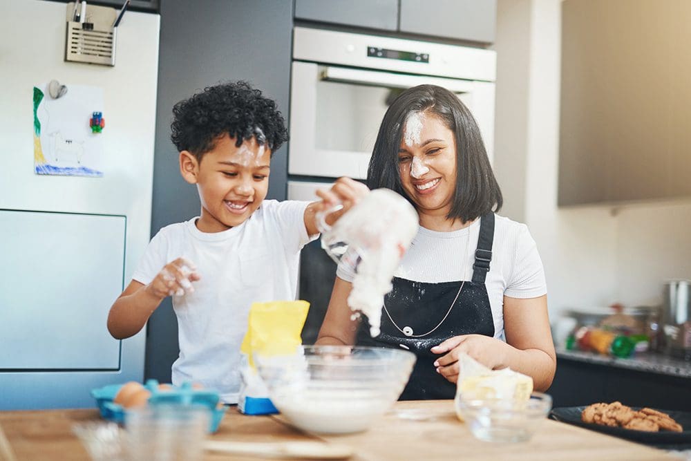 Mother and son baking together