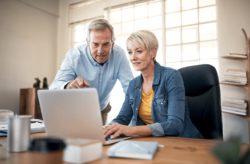 Couple at computer looking at finances