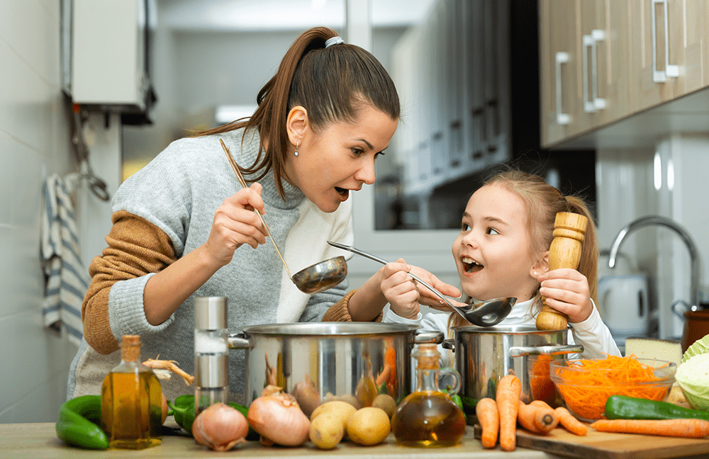 Mother and daughter making BetterLife member soup recipe together