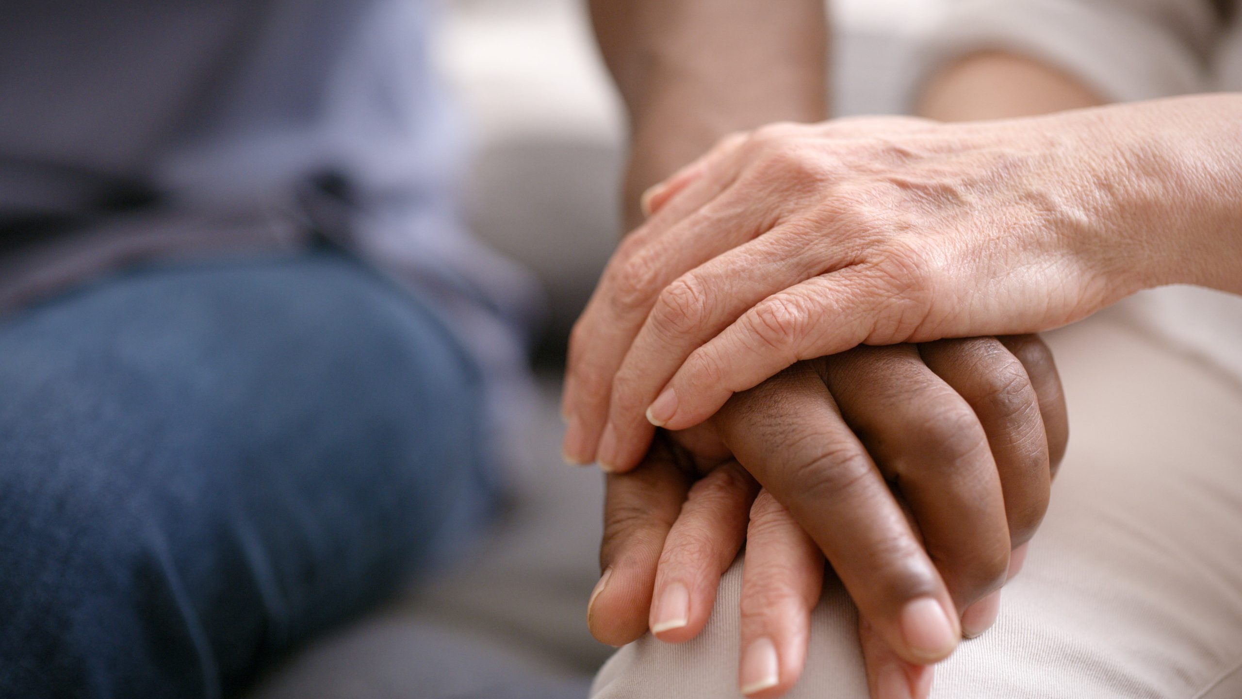 Two hands holding.