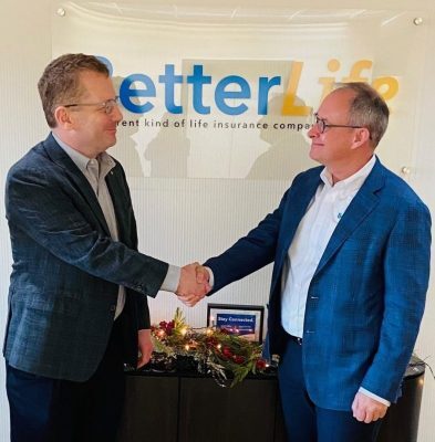 John Kielczewski, CSA President and CEO, shaking hands with Chris Campbell, BetterLife CEO and Board Chair, after signing the merger agreement.
